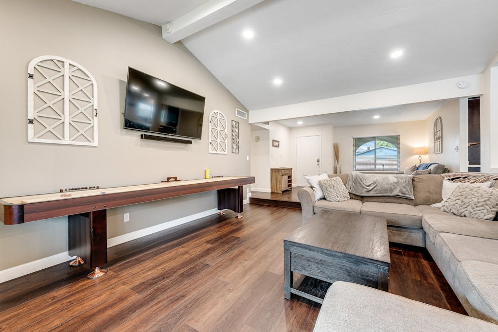 Dog-friendly home with enclosed yard, pool, putting green, grill, foosball, & AC