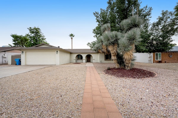 Dog-friendly home with enclosed yard, pool, putting green, grill, foosball, & AC