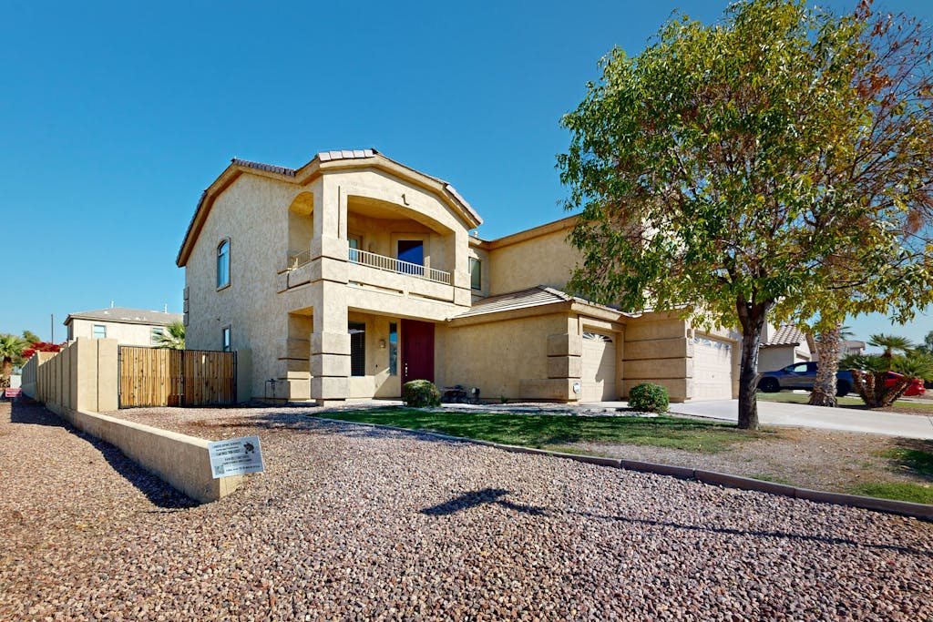 Spacious home surrounded by palms with pool, grill, children's items, & W/D