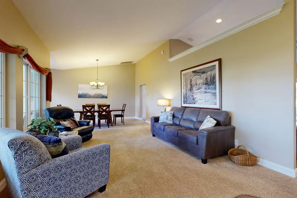 Tree-lined retreat with a hot tub, grill, game room, & W/D - mountain views