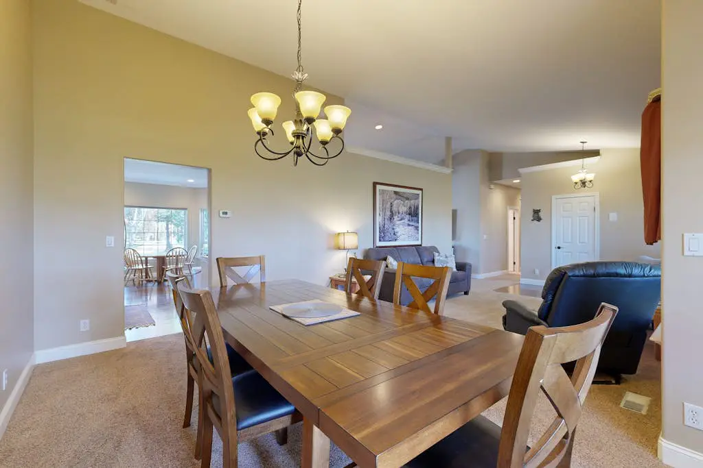 Tree-lined retreat with a hot tub, grill, game room, & W/D - mountain views