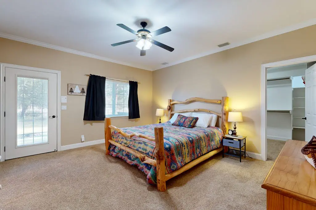 Tree-lined retreat with a hot tub, grill, game room, & W/D - mountain views