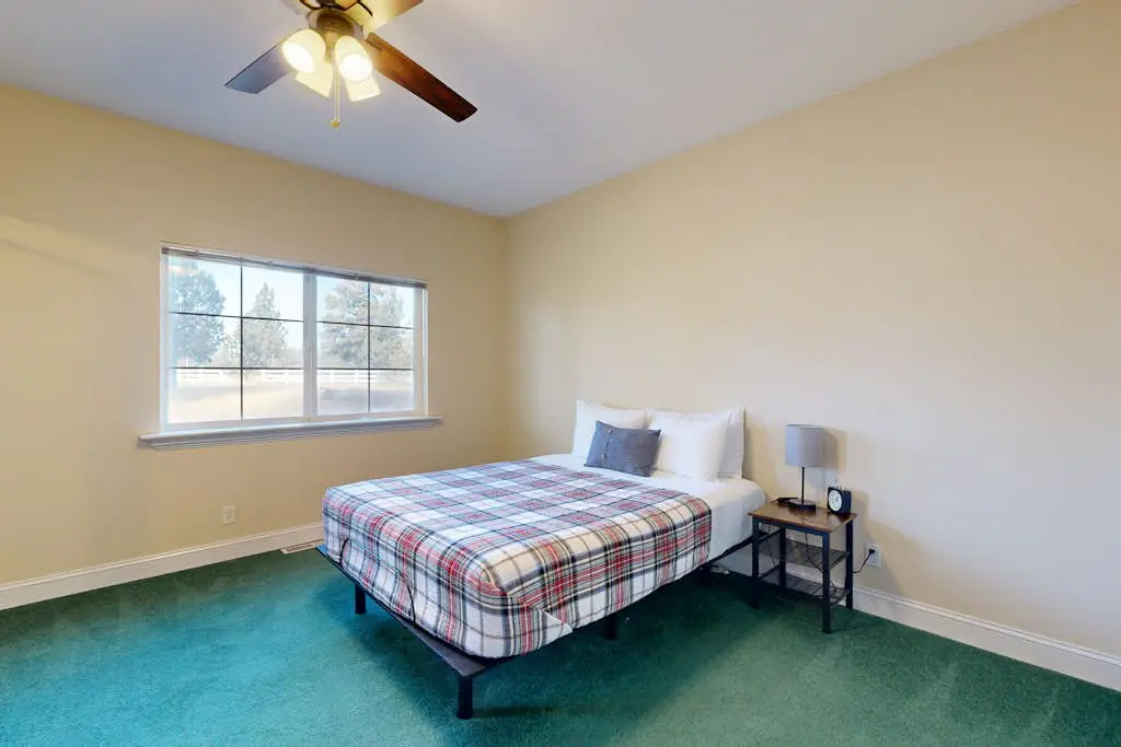 Tree-lined retreat with a hot tub, grill, game room, & W/D - mountain views
