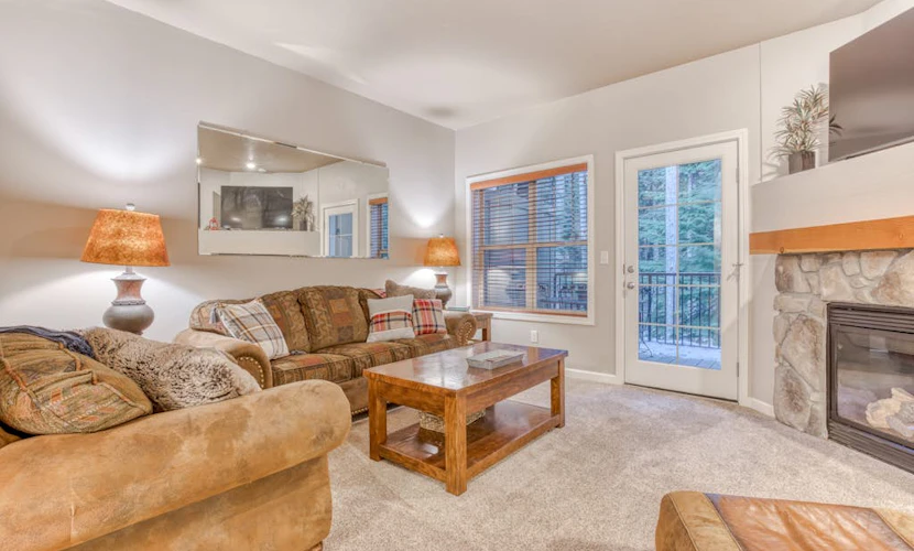 Comfortable condo with fireplace, heated pool, hot tub, balcony & full kitchen