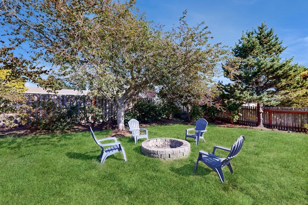 Charming home near ocean with patio, firepit, WiFi, streaming, and wood stove