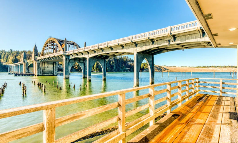 Incredible Riverfront Oasis with Wraparound Deck & Cozy Interior