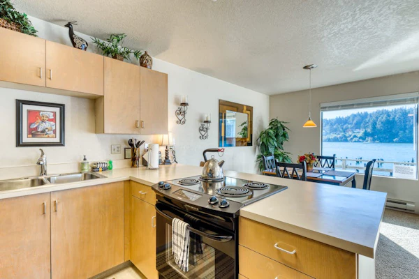 Incredible Riverfront Oasis with Wraparound Deck & Cozy Interior