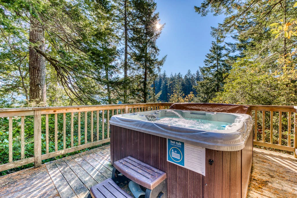 Dog-Friendly Home with Expansive Deck with Hot Tub and Dock on Woahink Lake