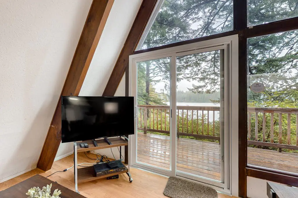 Dog-Friendly Home with Expansive Deck with Hot Tub and Dock on Woahink Lake