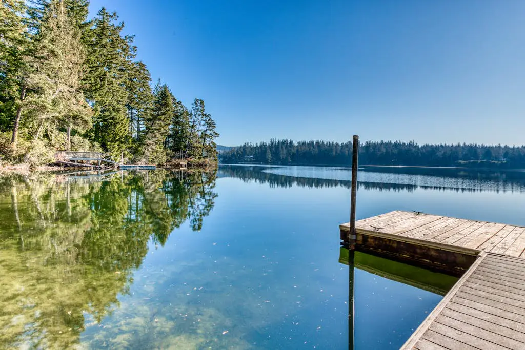 Dog-Friendly Home with Expansive Deck with Hot Tub and Dock on Woahink Lake