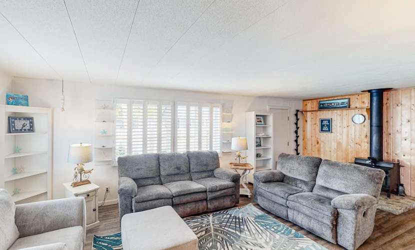Retro-chic retreat near the beach with a fenced yard & deck, & washer/dryer