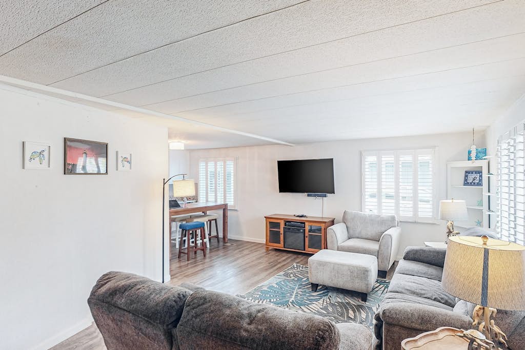 Retro-chic retreat near the beach with a fenced yard & deck, & washer/dryer