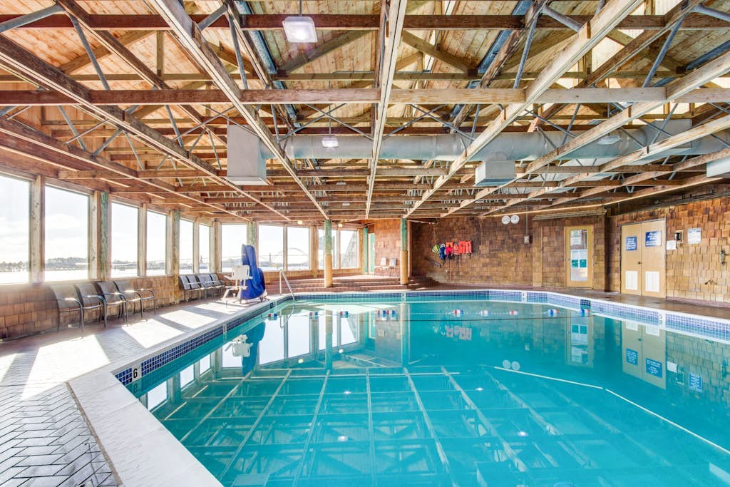 Waterfront Condo with Private Deck, Bay Views, Pool, Hot Tub, & Sauna