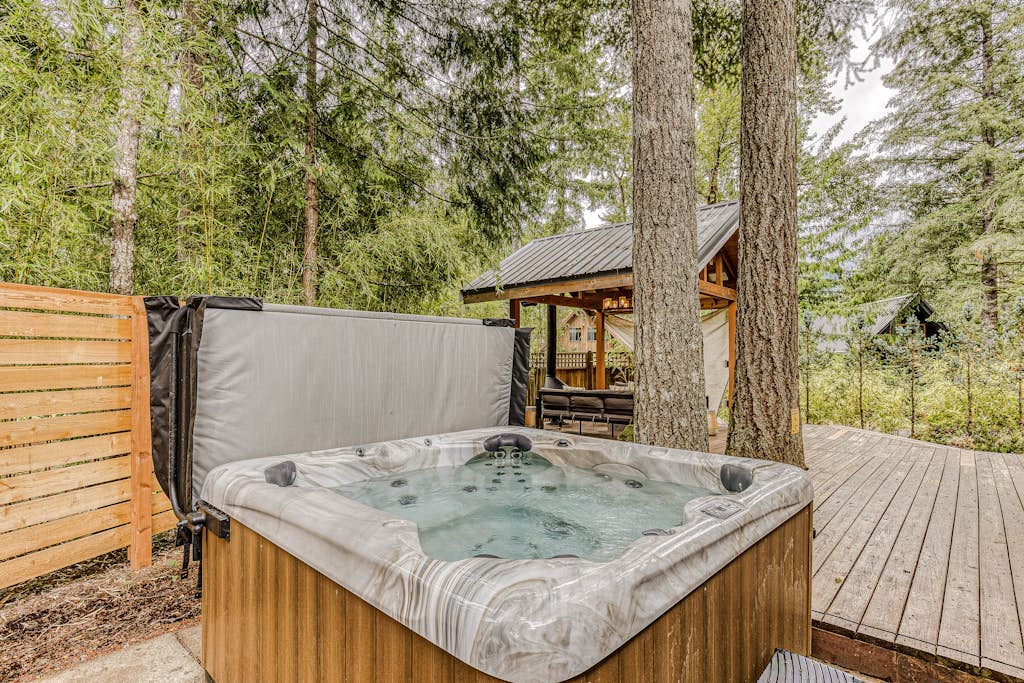 Dog-friendly home with hot tub, shared pool, firepit, fireplace, & river access