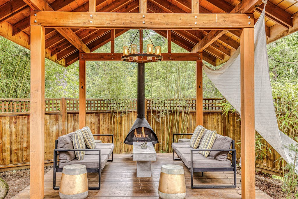 Dog-friendly home with hot tub, shared pool, firepit, fireplace, & river access