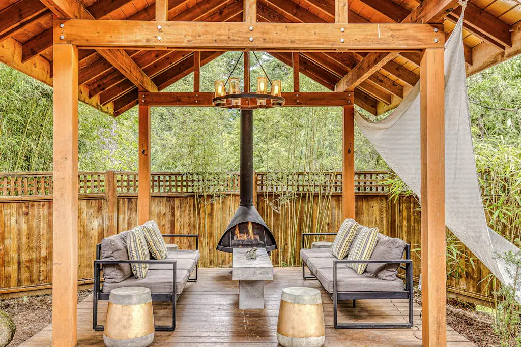 Dog-friendly home with hot tub, shared pool, firepit, fireplace, & river access