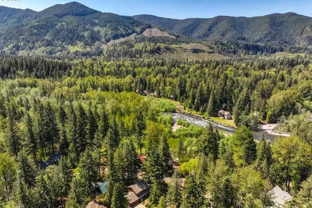 Dog-friendly home with hot tub, shared pool, firepit, fireplace, & river access