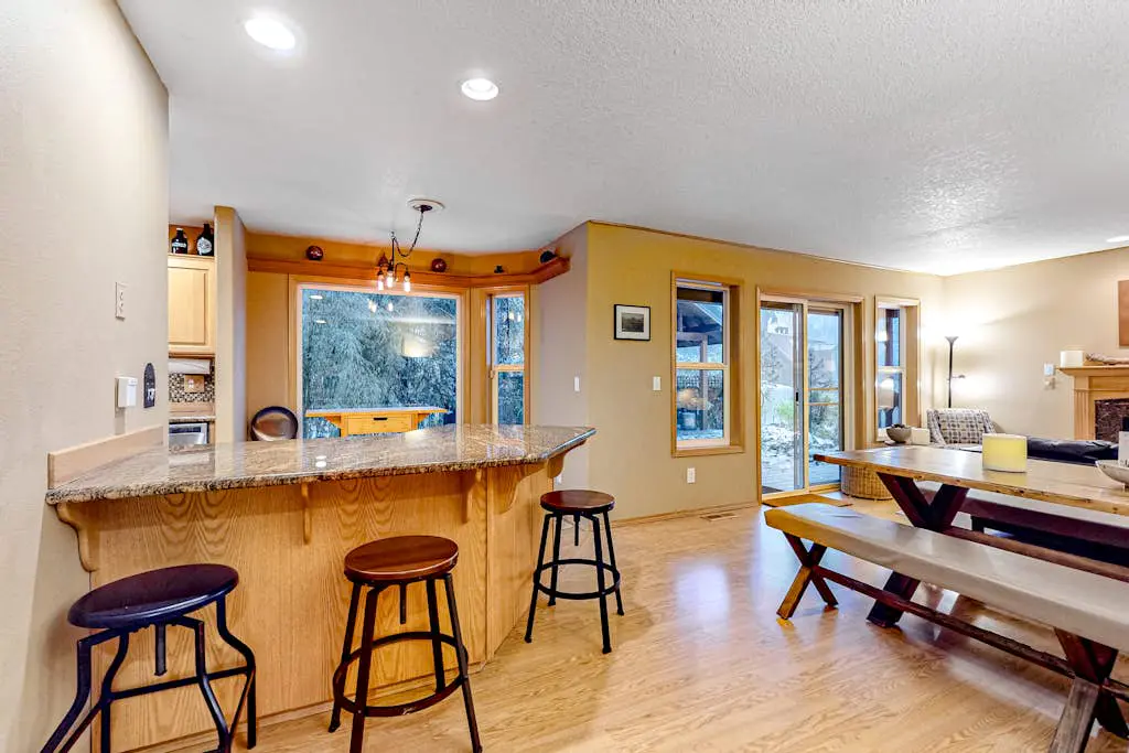 Dog-friendly home with hot tub, shared pool, firepit, fireplace, & river access