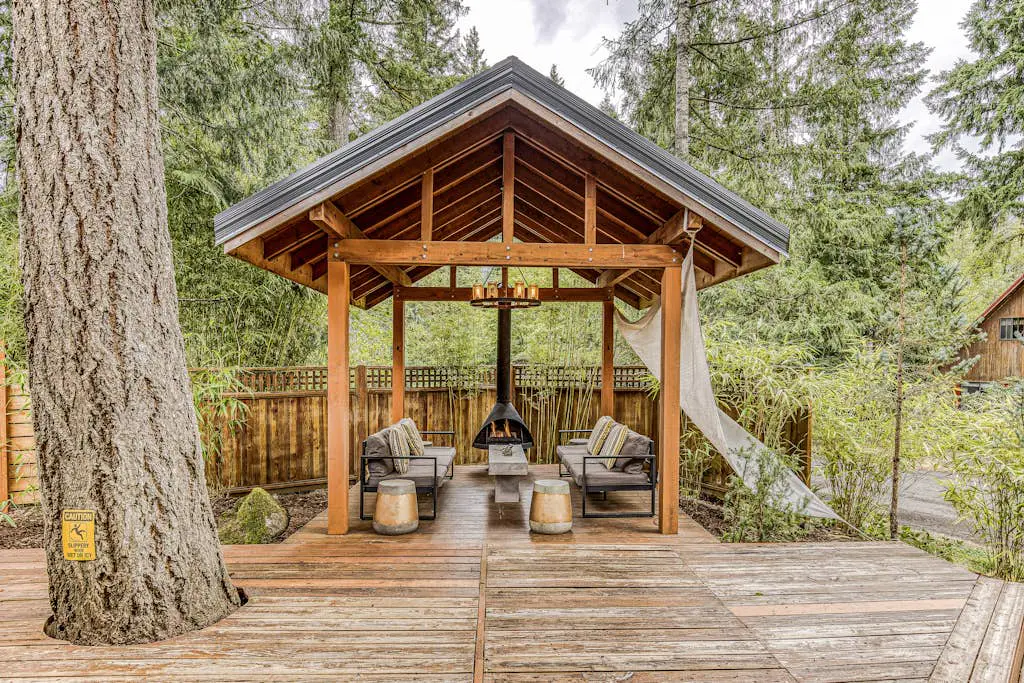 Dog-friendly home with hot tub, shared pool, firepit, fireplace, & river access