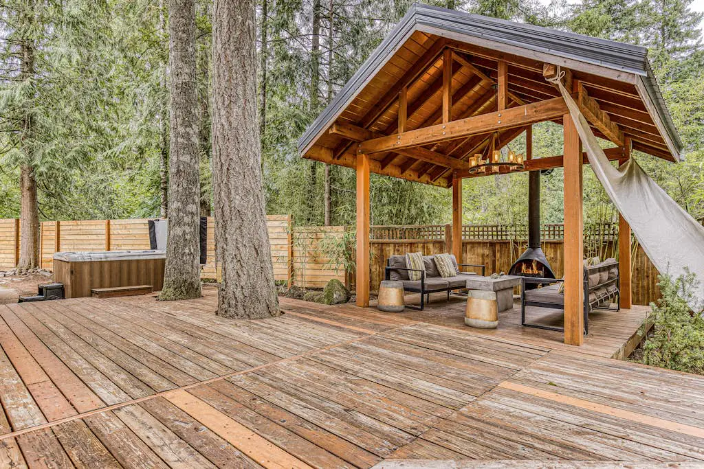 Dog-friendly home with hot tub, shared pool, firepit, fireplace, & river access