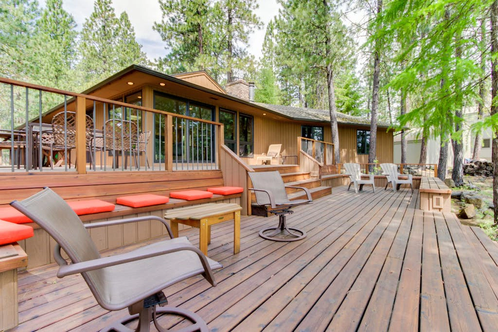Resort home with pool, hot tub, three-tier decks, & golf course views