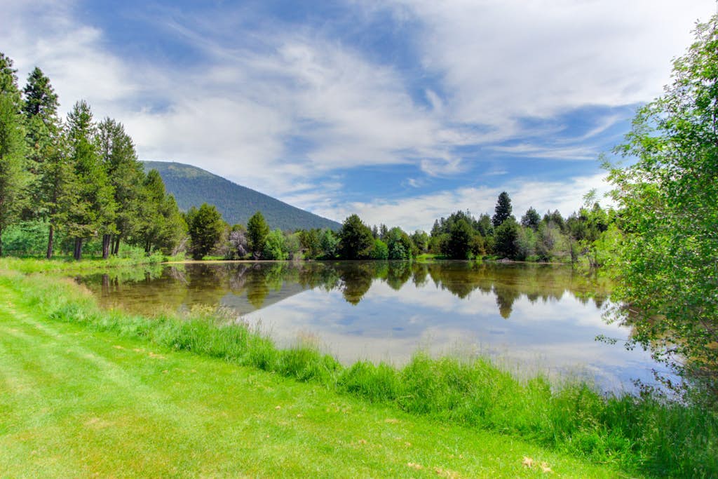 Resort home with pool, hot tub, three-tier decks, & golf course views