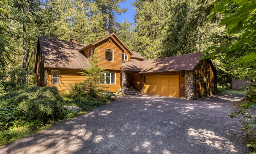 Classic riverfront home w/ great views, game room, hot tub, & modern cabin feel