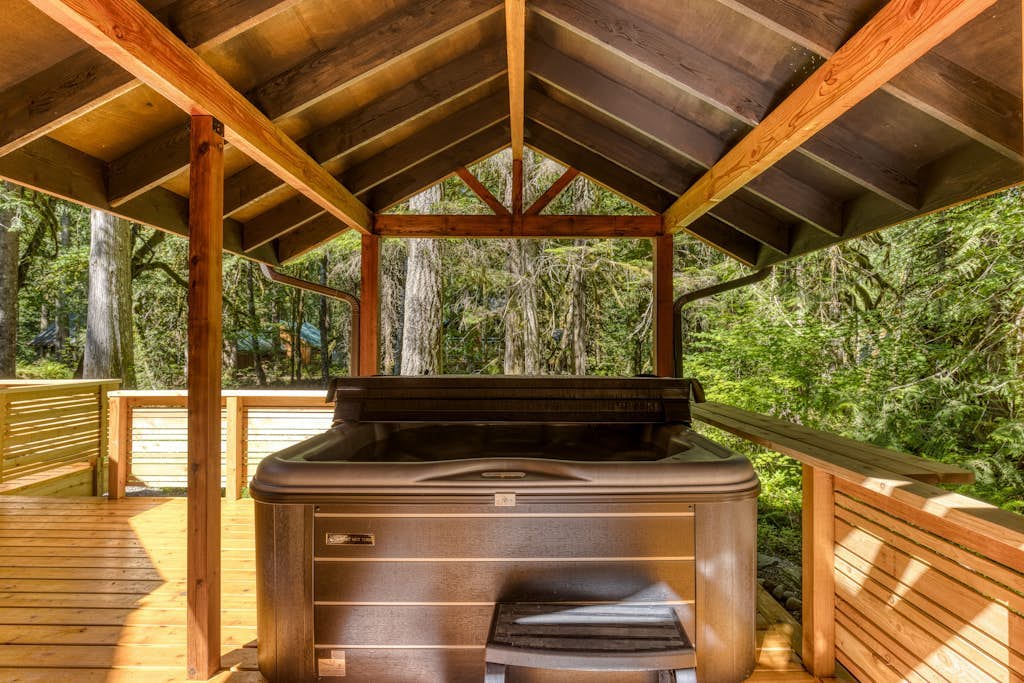 Classic riverfront home w/ great views, game room, hot tub, & modern cabin feel