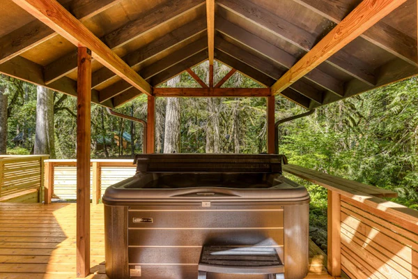 Classic riverfront home w/ great views, game room, hot tub, & modern cabin feel