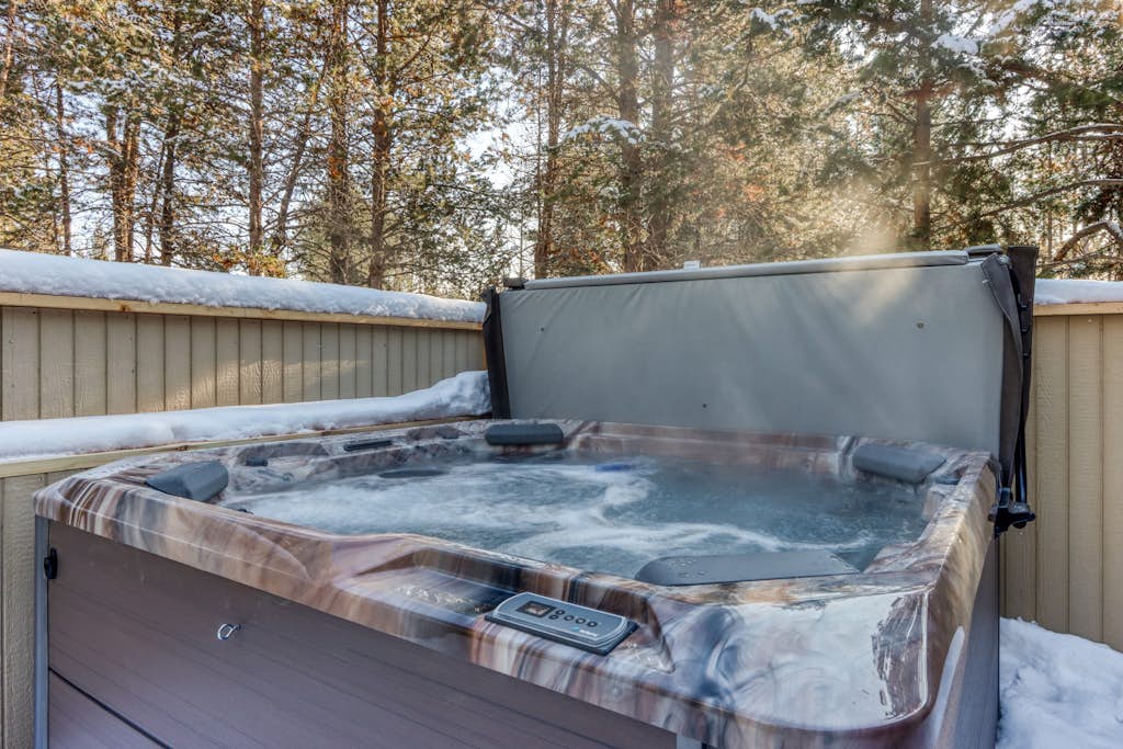 Lovely home near town with private hot tub, scenic deck, W&D, & chic decor