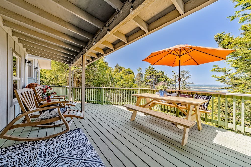 Charming coastal home with water views, large covered deck