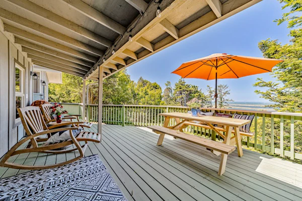 Charming coastal home with water views, large covered deck