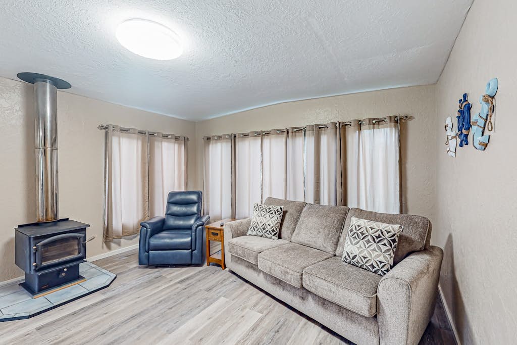 Spacious coastal property with separate living quarters, wood stove, & grill