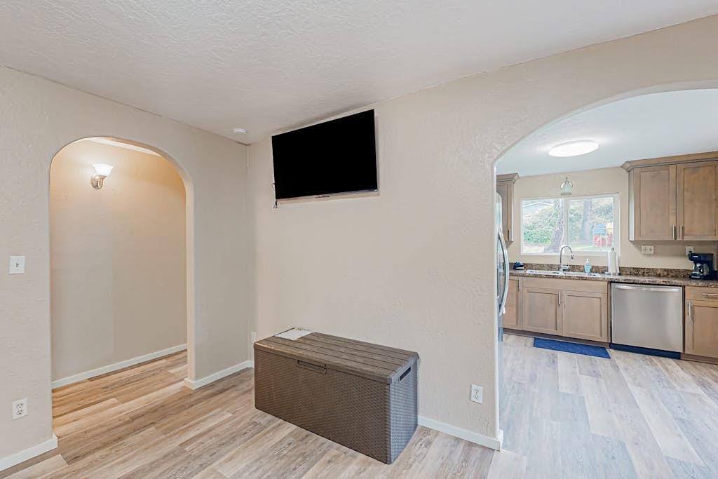 Spacious coastal property with separate living quarters, wood stove, & grill