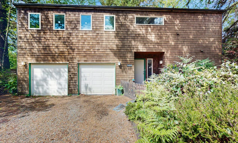 Forest-view home w/ fireplace, deck - Walk to the Beach & Golf Course