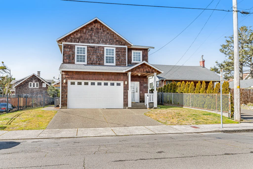 Charming coastal home close to the beach with a fireplace, yard, & W/D