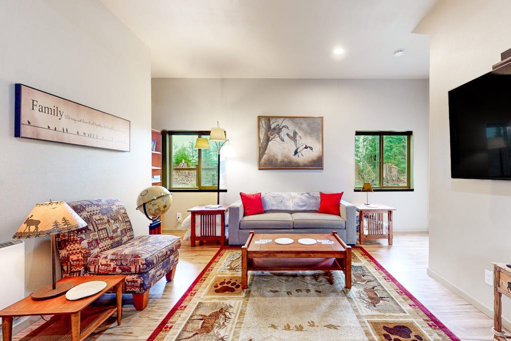 Coastal acreage with wrap-around deck & furnished patio - great location