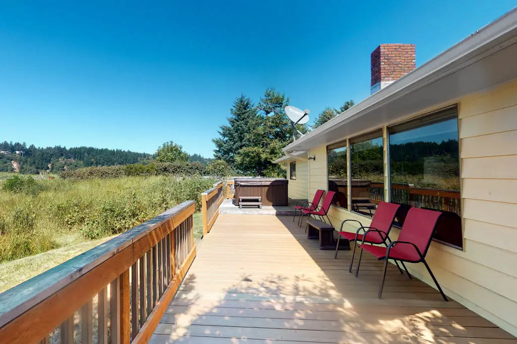 Dog-friendly house on Alsea Bay with bridge views, grill & private hot tub