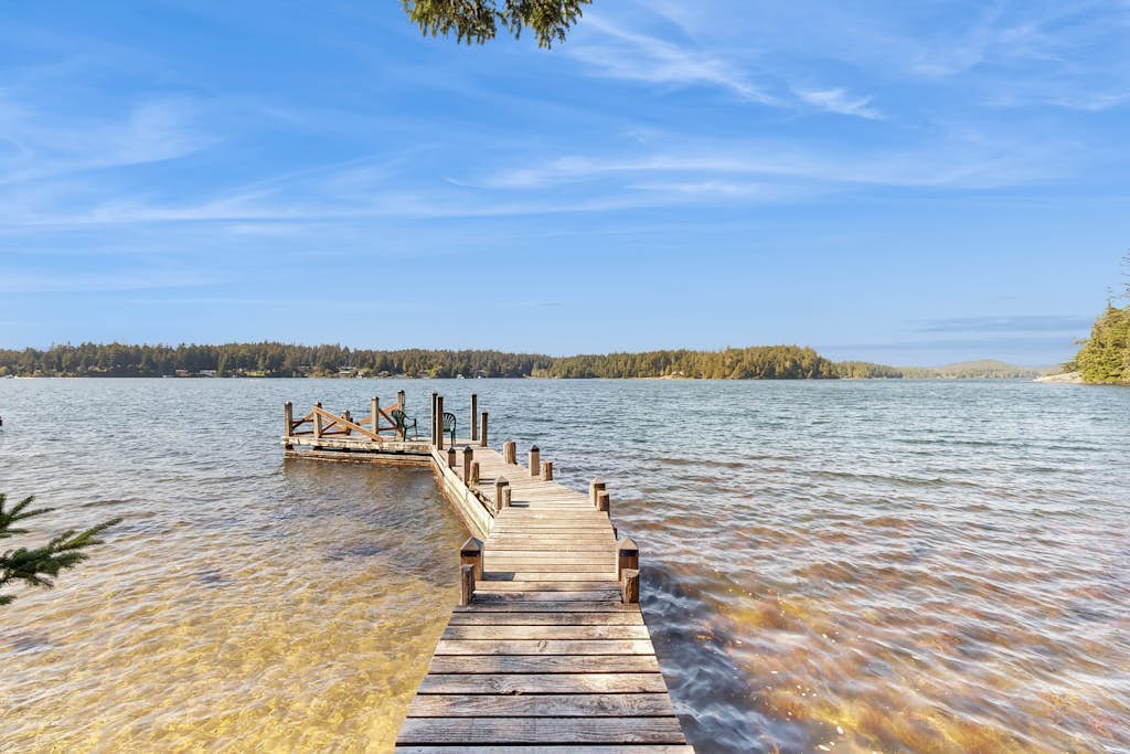Unique lakefront cabin near the dunes with a private dock & fireplace