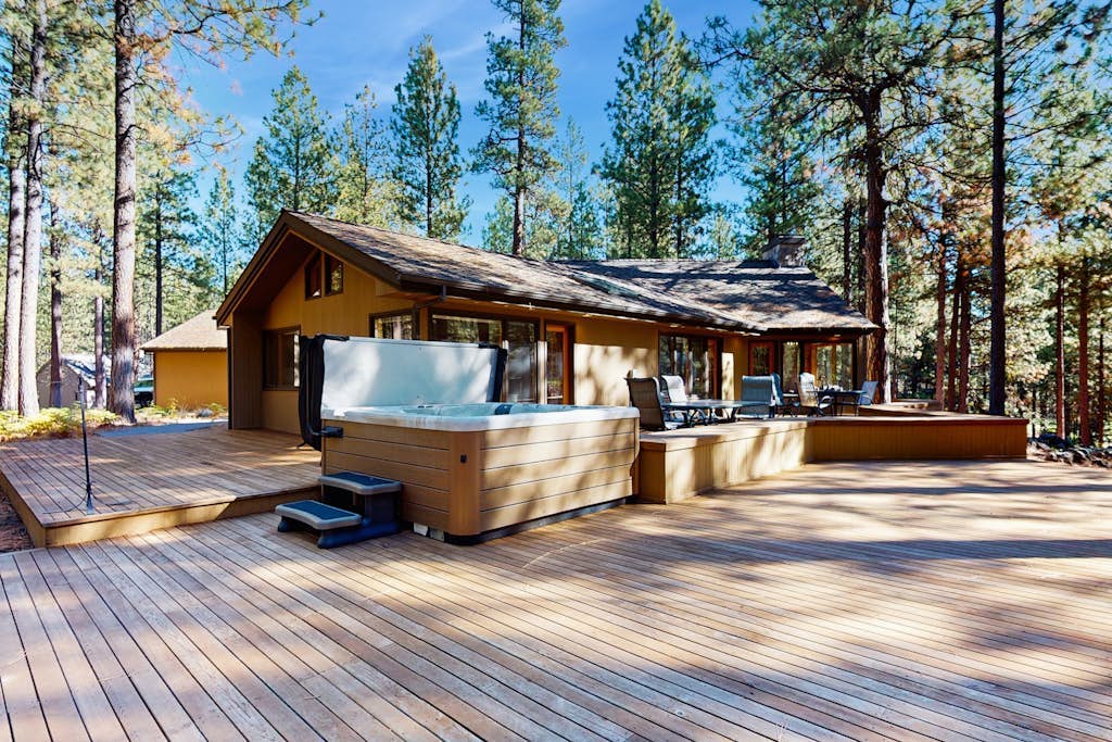 Tree-lined home with private hot tub, 7 pools, 14 tennis courts, golf, gym, AC