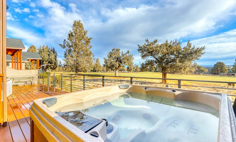 Golf course-front home with deck, hot tub, fireplace, W/D, community pool