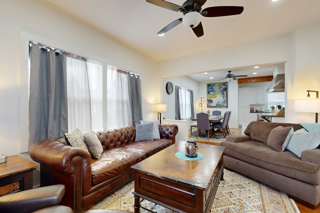 Relaxing river-view home with private patio, grill, covered balcony, & W/D