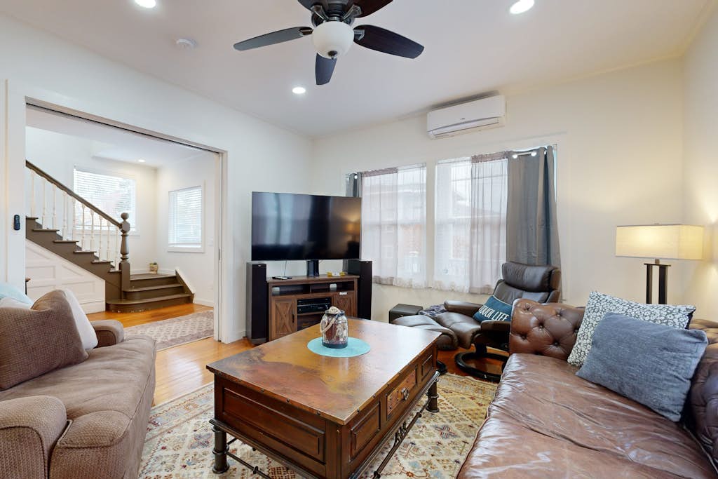 Relaxing river-view home with private patio, grill, covered balcony, & W/D