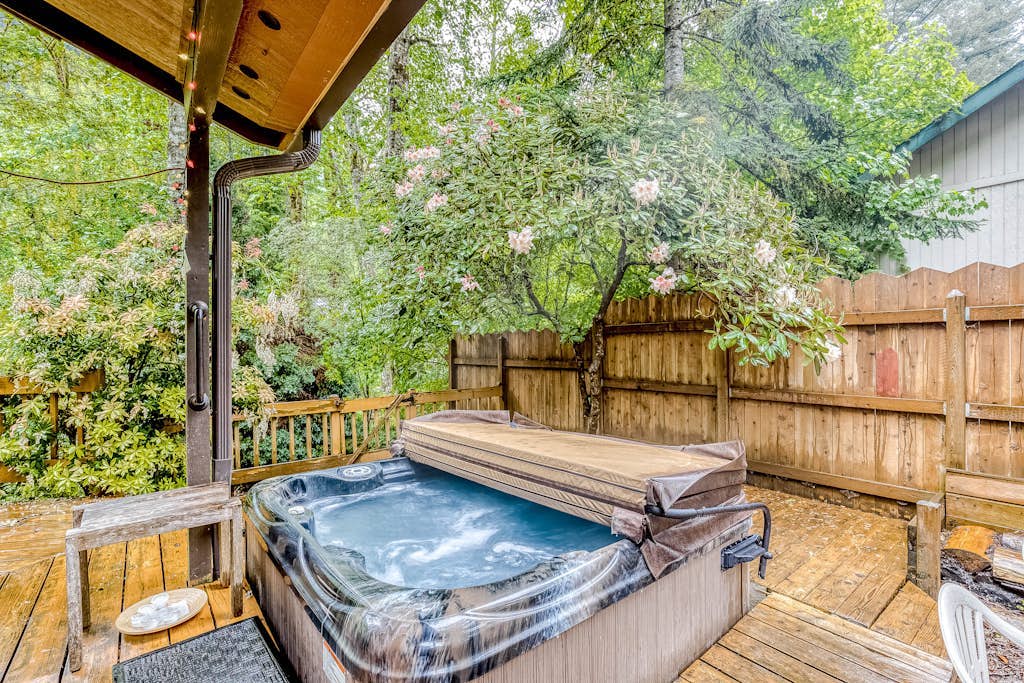 Expansive Wooded Home with a Brook, Firepit, Private Hot Tub and Shared Pool