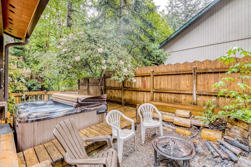 Expansive Wooded Home with a Brook, Firepit, Private Hot Tub and Shared Pool