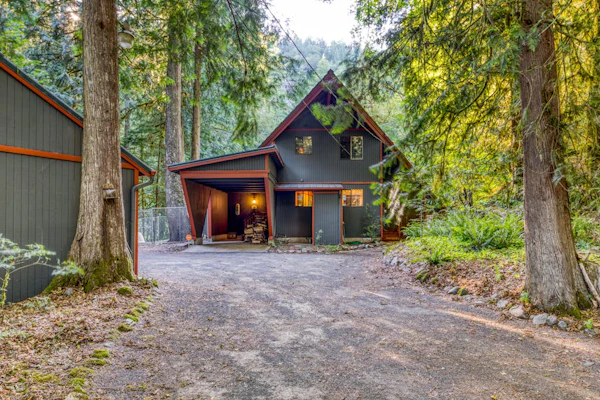 Creekside home with hot tub, deck, & great woodland views