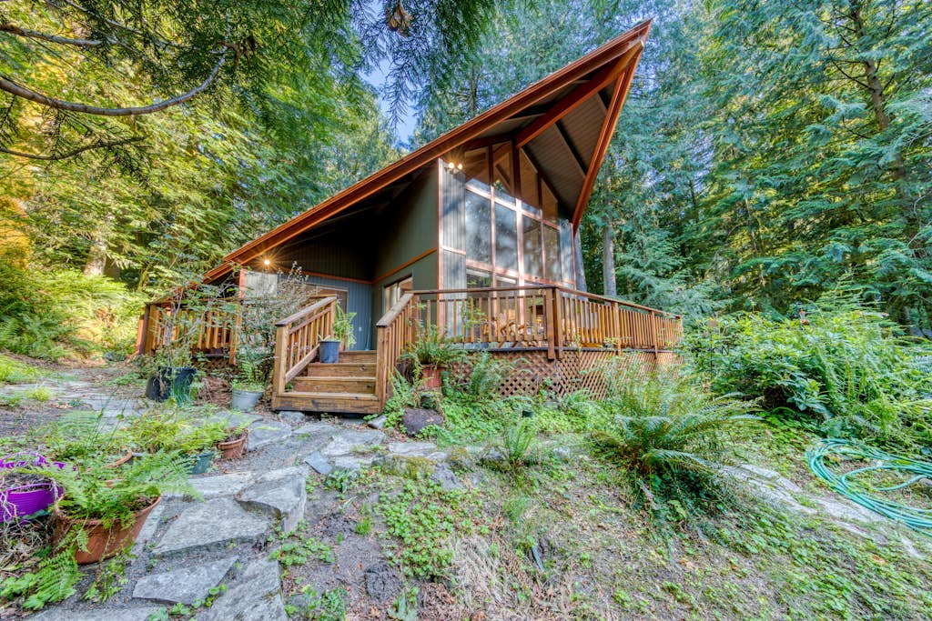 Creekside home with hot tub, deck, & great woodland views
