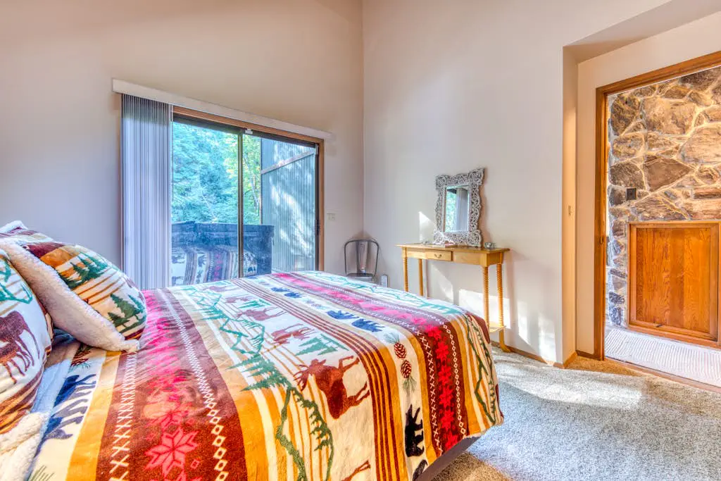 Creekside home with hot tub, deck, & great woodland views