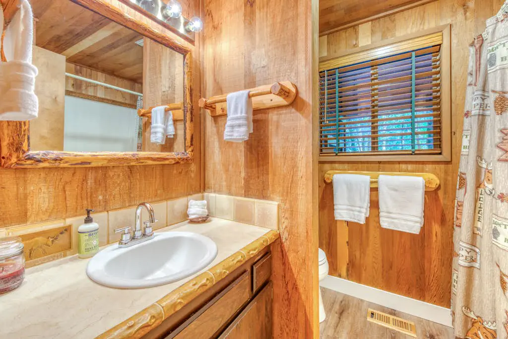 Creekside home with hot tub, deck, & great woodland views