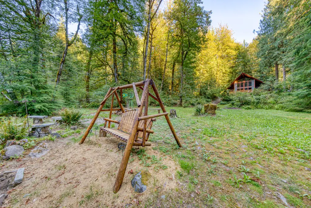 Creekside home with hot tub, deck, & great woodland views